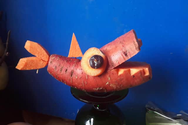 A shark character made out of a sweet potato.