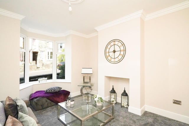 The living room is incredibly spacious and bright thanks to the large bay window at the front of the property.