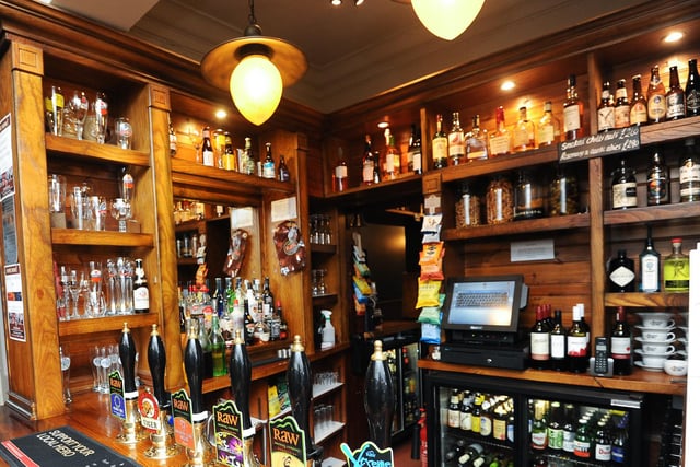 Which pub would you be in if you were looking at this wooden bar?