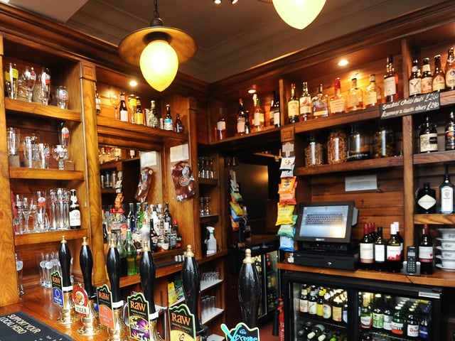 Which pub would you be in if you were looking at this wooden bar?