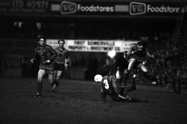 Paul Sturrock jumps a tackle by Barcelona defender Migueli during the European tie at Tannadice, Dundee.