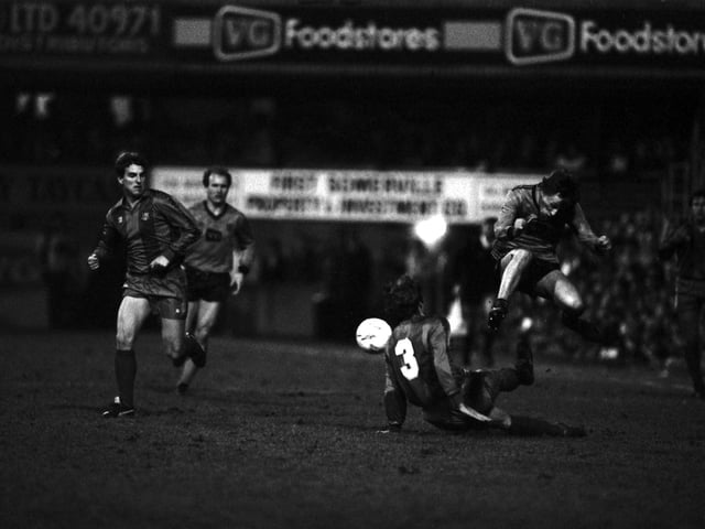 Paul Sturrock jumps a tackle by Barcelona defender Migueli during the European tie at Tannadice, Dundee.