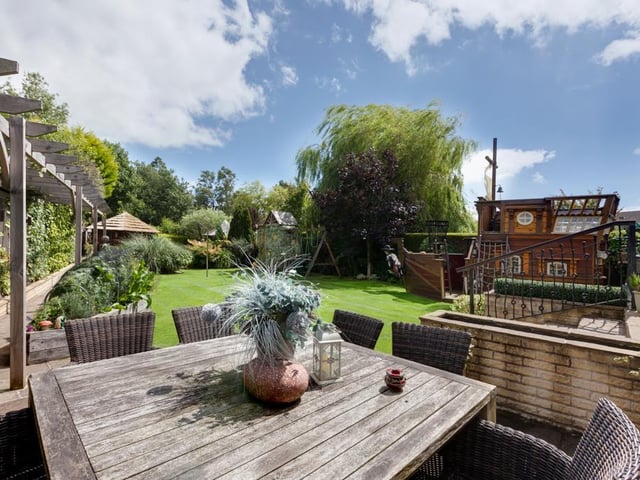 To the rear of the property is a stone flagged terrace that is ideal for al fresco dining - it sits adjacent to the lawns, with stone paths leading down to a summerhouse.