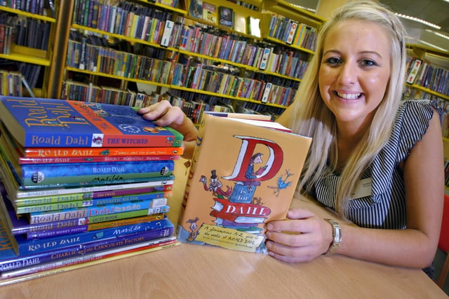 Sunderland City Library and Information Assistant Sophie Johnston with some of the Roald Dahl books from the library shelves. How many of his books have you read?