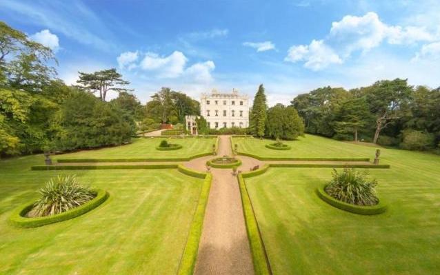 Externally, there is approximately 14 acres of landscaped gardens and mature woodland, along with parking for up to eight vehicles
