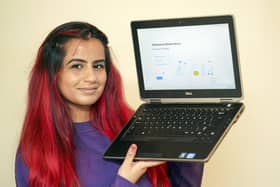 Support worker Rehneesa Inez makes a charity laptop presentation to Linda, a vulnerable Sheffield pensioner, who says her new laptop will help her reconnect with the world.