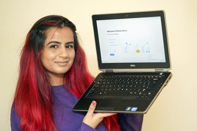 Support worker Rehneesa Inez makes a charity laptop presentation to Linda, a vulnerable Sheffield pensioner, who says her new laptop will help her reconnect with the world.