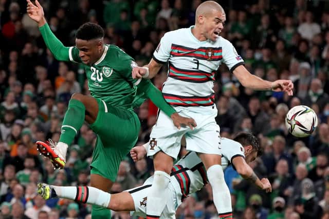 Rotherham's Republic of Ireland midfielder Chiedozie Ogbene (L) vies with Portugal's defender Pepe (C) during the FIFA World Cup Qatar 2022 qualifying round Group A football match between Ireland and Portugal at the Aviva Stadium in Dublin on November 11, 2021. (Photo by PAUL FAITH / AFP) (Photo by PAUL FAITH/AFP via Getty Images)