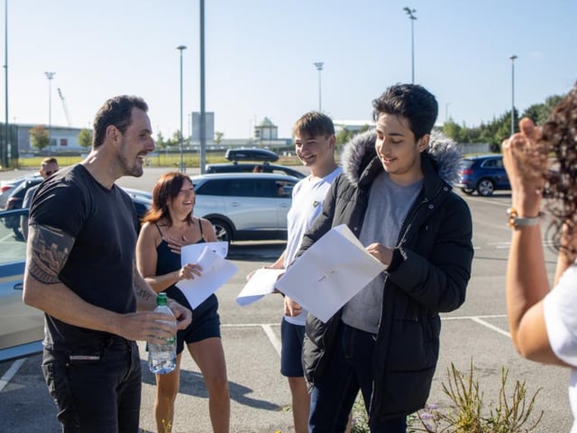 Pupils at XP School pick up their results