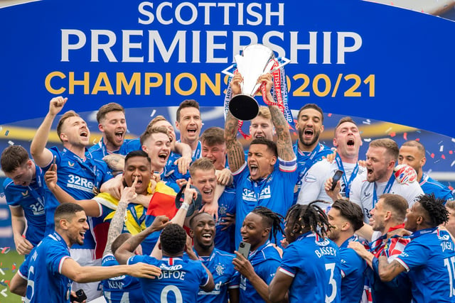 Rangers' James Tavernier lifts the Premiership trophy at Ibrox Stadium, on May 15, 2021, in Glasgow, Scotland.