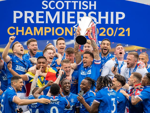 Rangers' James Tavernier lifts the Premiership trophy at Ibrox Stadium, on May 15, 2021, in Glasgow, Scotland.