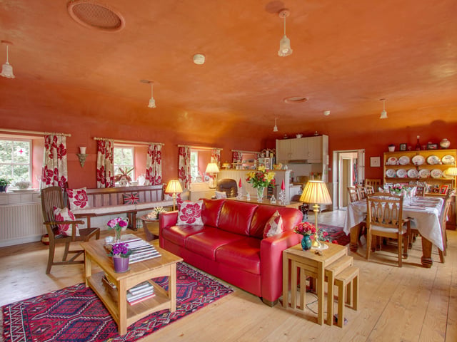 The open-plan living and dining area offers a modern feel to this historical dwelling