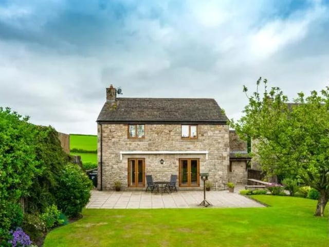 This four bedroom barn conversion offers lots of open plan living spaces and glorious panoramic views of the Lancashire countryside. The wonderfully renovated property offers beautiful high vaulted ceilings, exposed wooden beams and lintels, as well as French doors, leading into the pristine rear garden. Listed on OntheMarket for 450,000 GBP