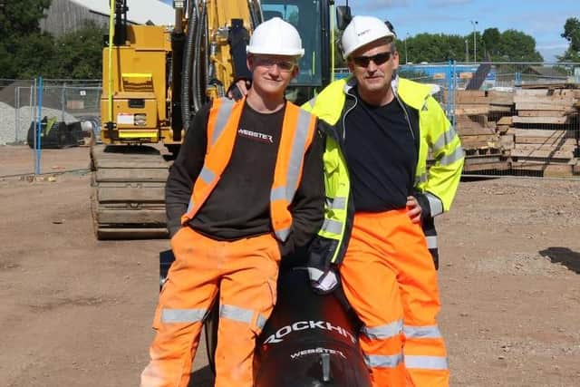 Ian Webster, right, with son Matt and a Webster Technologies Rock Hit.