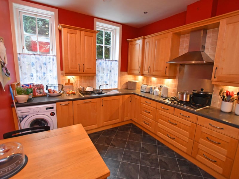 The kitchen is at the rear of the ground-floor apartment.