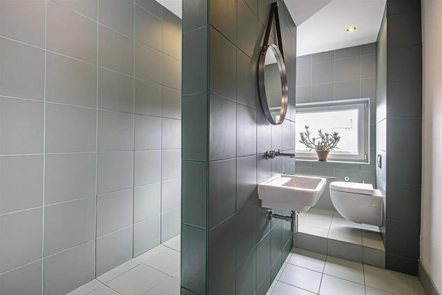 The well appointed shower room has a walk-through shower area along with Villeroy and Boch fittings.