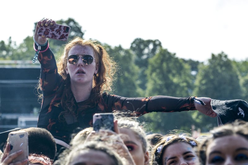 Fans grabbing pictures and video while Miles Kane performs on the main stage in Hillsborough Park as Tramlines 2019 gets into full swing