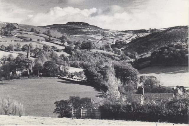 England's green and pleasant land is epitomised in this autumn scene at the picturesque Peak District village of Hathersage looking up the valley of Dale Bottom towards the high ground of the Hallam and Burbage moors. Lower left can be seen the steeple of the village church, burial place of the legendary outlaw Little John in 1981