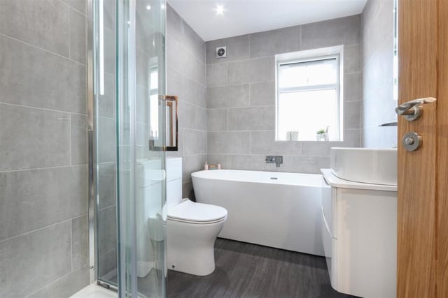 The en-suite bathroom, leading off the master bedroom, includes a bath and a shower.