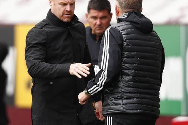Sean Dyche, Manager of Burnley shakes hands with Chris Wilder, Manager of Sheffield United following the Premier League match between Burnley FC and Sheffield United at Turf Moor. (Photo by Clive Brunskill/Getty Images)