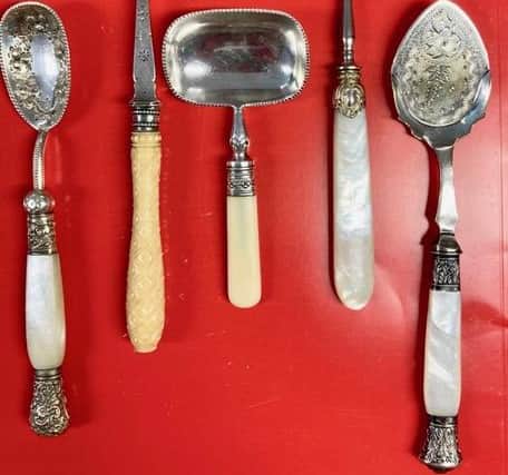 Top to bottom: a jam spoon with decorated ferrule and finial, Stilton scoop with carved ivory handle, butter spade, caviar and bon bon spoon and an unusual serving spoon whose purpose is unknown. All from the Dennis Smith bequest to the Hawley Collection