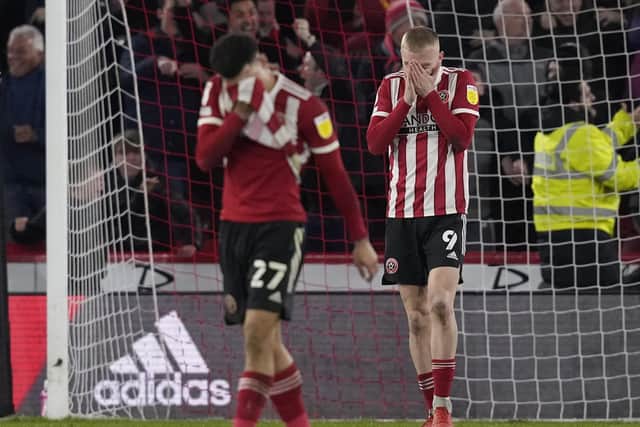 Deflation for Oli McBurnie and Morgan Gibbs-White of Sheffield United after their late draw against Nottingham Forest: Andrew Yates / Sportimage
