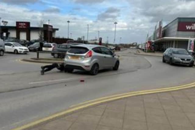 This picture shows the dramatic moment when a suspected car thief fell out of a ‘getaway vehicle’ as his gang fled after being spotted at Parkgate in Rotherham