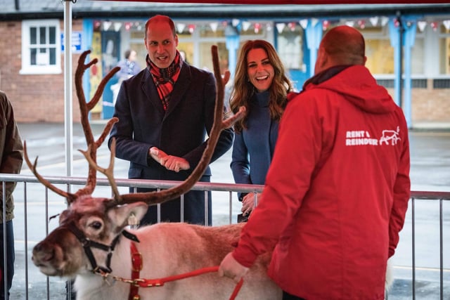 The Duke and Duchess meet Chaz the reindeer, a surprise for the children from Kensington Palace. Picture: Dawn Robertson