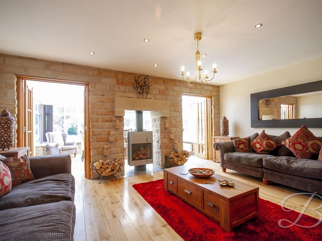 The rear lounge, with access to the conservatory.