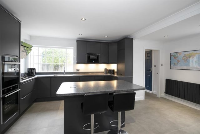 The large recently fitted living kitchen with island unit is well fitted out and has an adjacent dining area