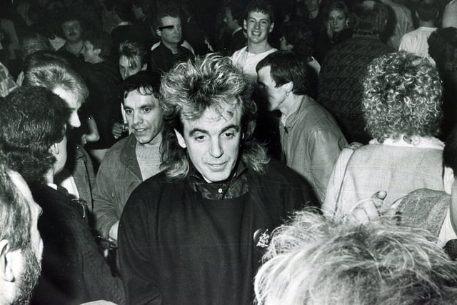 Sheffield-born clubbing impresario Peter Stringfellow with friends during the King Mojo Christmas party held at the Leadmill, Sheffield, in December 1984