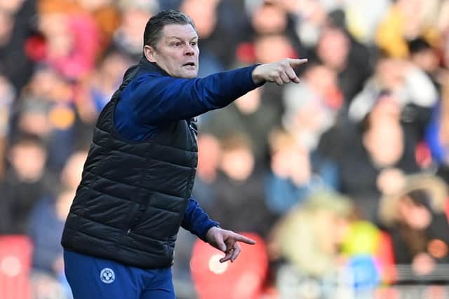 Shrewsbury Town manager Steve Cotterill has been linked with the vacant manager's job at Wigan Athletic.