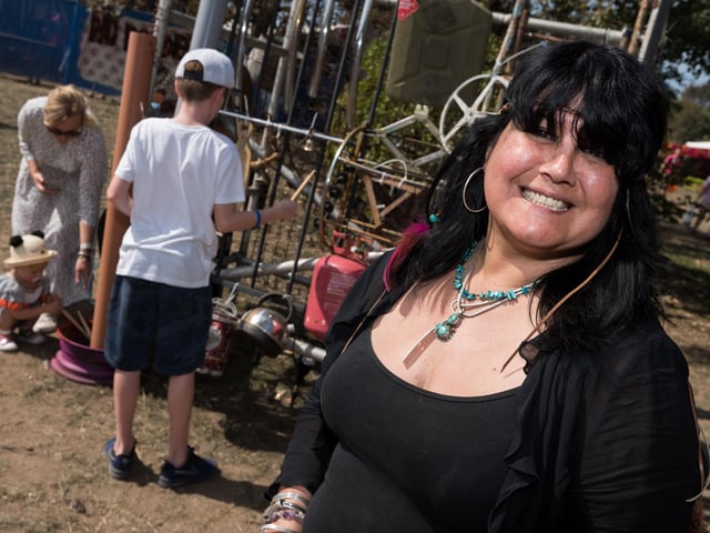 Artist Tina Sanchez with her interactive piece 'Recycle Rhythm Hub' at Victorious Festival 2019.