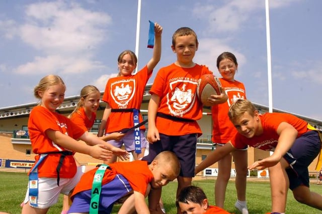 A bunch of kids playing tag rugby at the multi sport summer fun camp hosted by Doncaster Rugby Club in 2006.