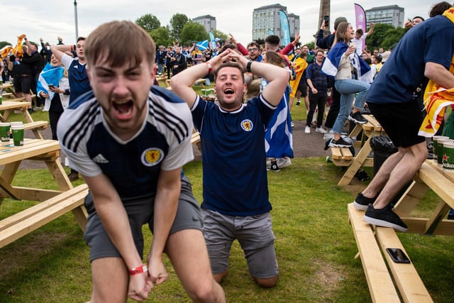 Scotland fans celebrate Callum McGregor's goal equaliser against Croatia at the Euro Fan Zone during Scotland's Euro 2020 campaign, at Glasgow Green, on June 22, 2021.