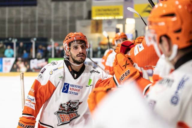 Tommaso Traversa is greeted by his team mates after scoring for Sheffield Steelers