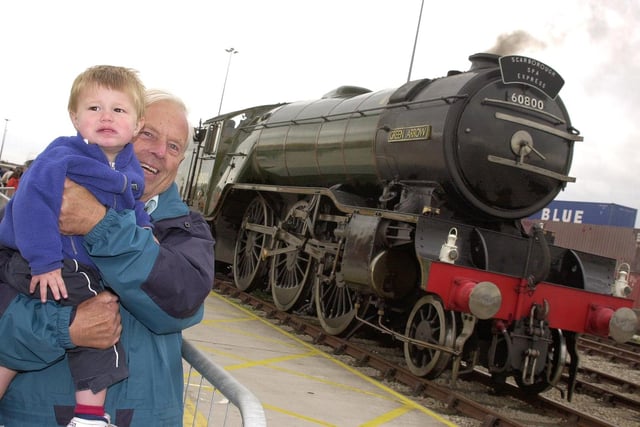 At the 2000 Festival of Steam and Speed  grandad Arthur Barnard, of Westwoodside, with grandson Alexander Gallagher, aged 14 months, of Haxey. Grandad obviously likes steam engines, but Alexander seemed a little unsure.