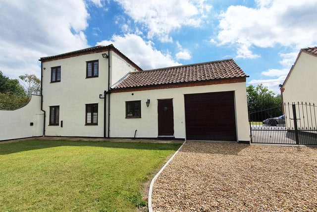 A four bedroom barn conversion that has been "decorated to a high standard".
