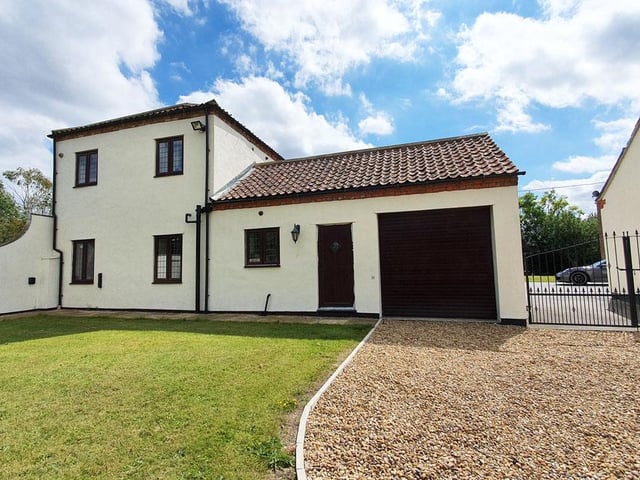 A four bedroom barn conversion that has been "decorated to a high standard".