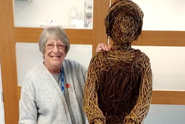 Janet Devanny, Lily Brandreth’s daughter, with the wicker sculpture honouring her mum and hundreds oof others