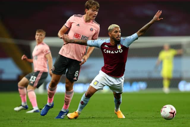 Sheffield United's Sander Berge and Aston Villa's Douglas Luiz (right) battle for the ball during the Premier League match at Villa Park, Birmingham. Clive Rose/NMC Pool/PA Wire.