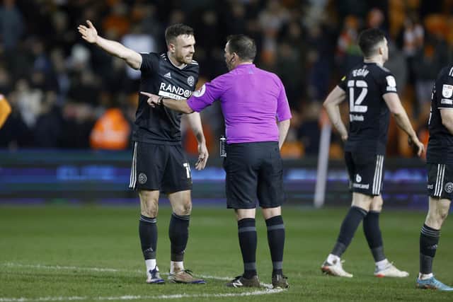 Sheffield United's Jack Robinson talks to the referee after the Sky Bet Championship match at Bloomfield Road, Blackpool: Richard Sellers/PA Wire.
