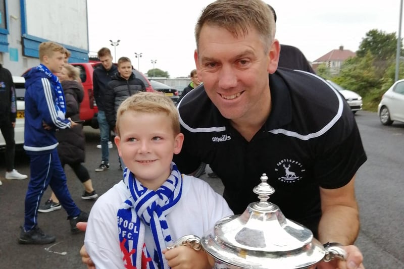 A treasured photograph for this young fan, pictured with Pools manager Dave Challinor.