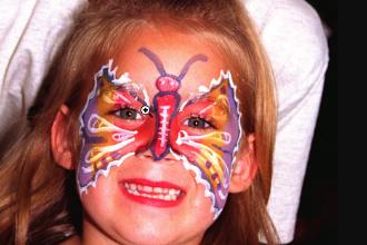 Alice Thompson aged 5 of Rawmarsh with her face painted as a butterfly. Painted at McDonalds in 1996.
