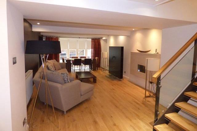 This stunning duplex in the west end comes with three bedrooms, a games/cinema room and a big living/dining space.