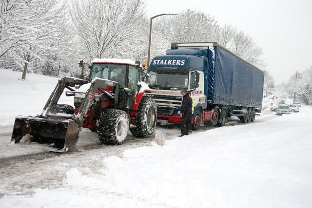 Snow ploughs Council workers try their best to free a lorry stuck on Edlington Lane in December 2010.