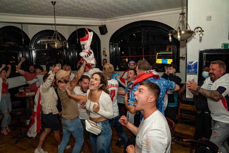 England fans celebrate at The Kings Pub in Southsea for the England vs Italy match on 11 July 2021. Picture: Andy Hornby