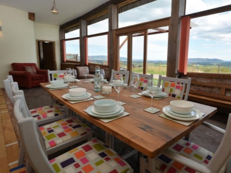 The large dining table comfortably seats seven, with gorgeous views.