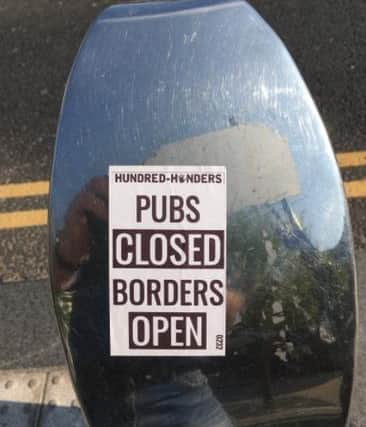 Two men in their 20s have been arrested by South Yorkshire Police in connection with stickers posted across Sheffield that link migration with the coronavirus pandemic.