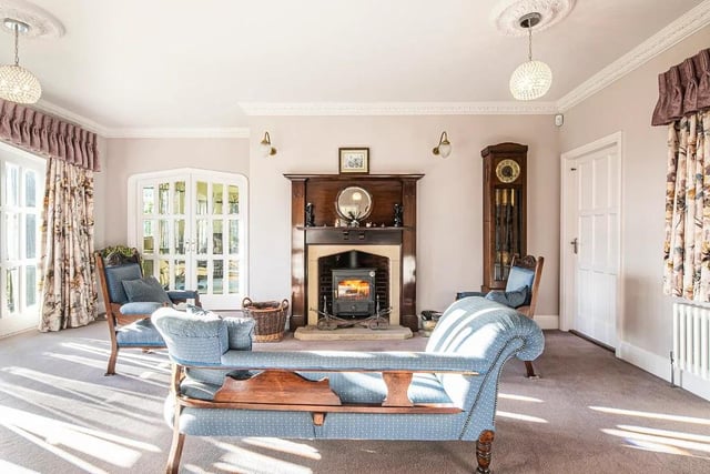 The house has a spacious sitting room, and a large reception hall with a Clearview stove and French windows to the gardens.